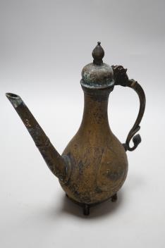 An Indian Islamic brass ewer, 27cm high